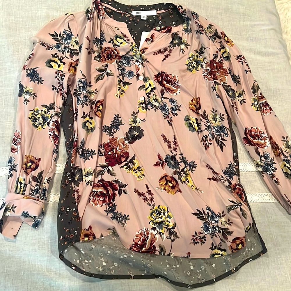 Beautiful pink blouse with flowers for dressing up or down.